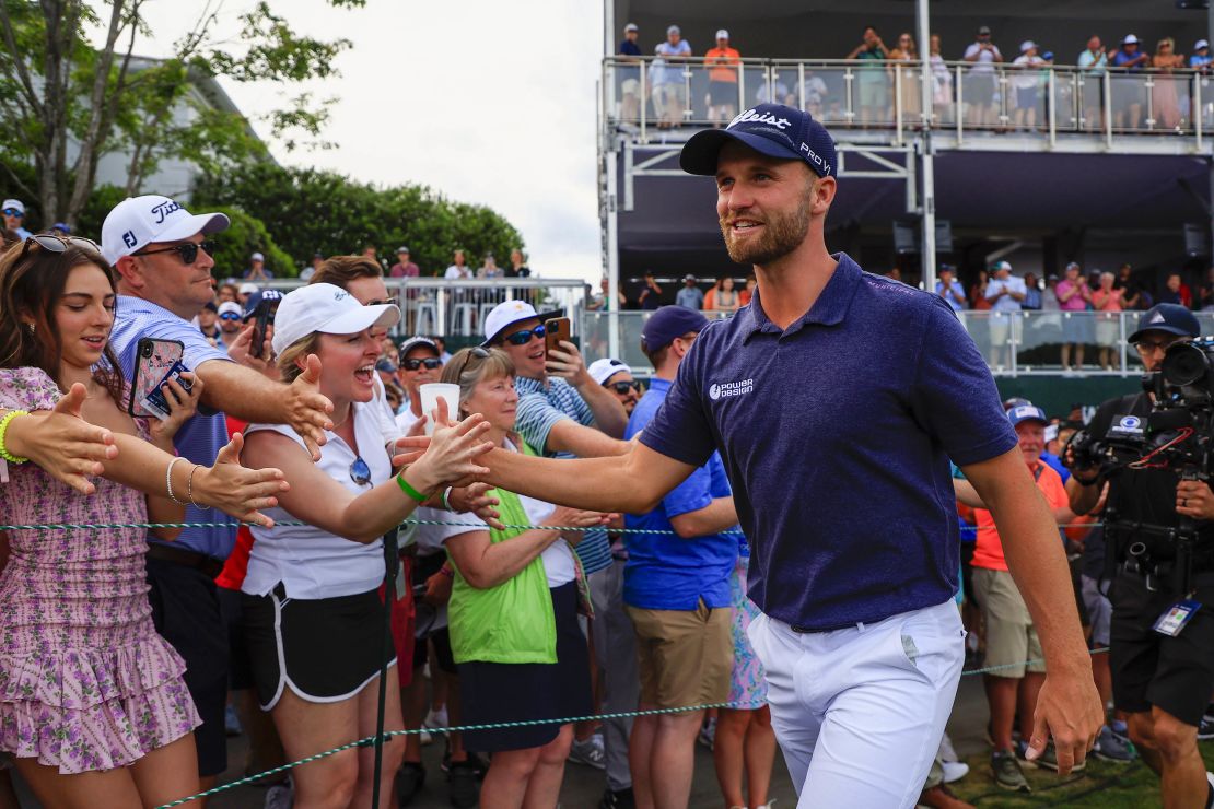 Clark celebrates with fans after winning.