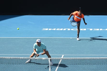 Rohan Bopanna serves over the top of doubles partner Matthew Ebden in the 2024 Australian Open