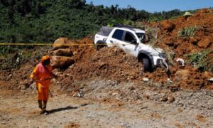 At least 34 people have been killed in Colombia after a mudslide struck a busy road.