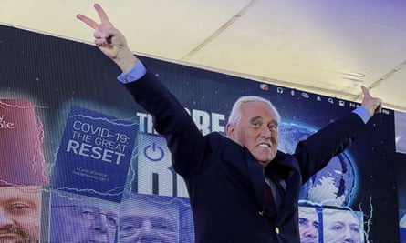 Roger Stone with arms raised