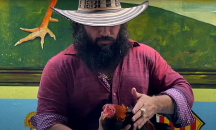 Adolfo Macías, alias Fito, in a music video showing him petting a cockerel in prison.