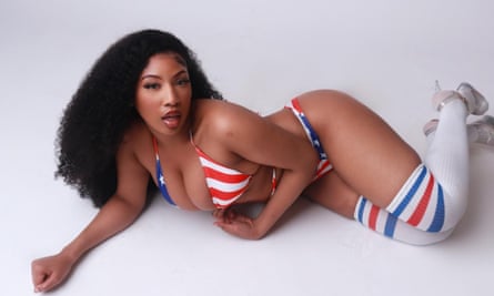 Ceechynaa reclining wearing a red, white and blue bikini