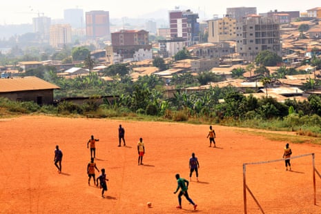 Boys in Yaounde, Cameroon, play football. Cameroon is often referred to as 'Africa in miniature' for its geological and cultural diversity. Natural features include beaches, deserts, mountains, rainforests, and savannas.