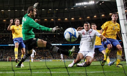 Steven Caulker scores past Andreas Isaksson during the international friendly match between Sweden and England at the Friends Arena in 2012