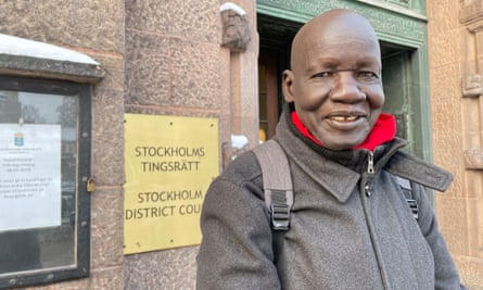 Reverend James Ninrew Dong outside the district court building in Stockholm.