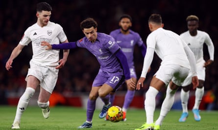 Curtis Jones battles for possession during Liverpool’s recent FA Cup victory over Arsenal. The midfielder has become a crucial part of his boyhood team