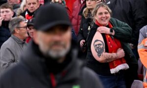 The unwavering affection for Klopp is evident through both vocal expressions and permanent ink, as the realization of his departure sets in.