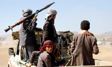 Houthi fighters and tribesmen stage a rally against the US and the UK strikes on Houthi-run military sites near Sana’a, Yemen, on 14 January