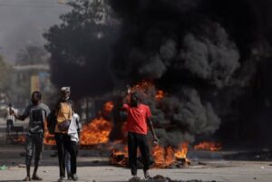 Police and demonstrators in Senegal engage in violent conflict, marking the first significant outbreak of unrest due to the postponement of the vote.