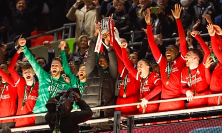 Liverpool celebrate with Carabao Cup trophy.
