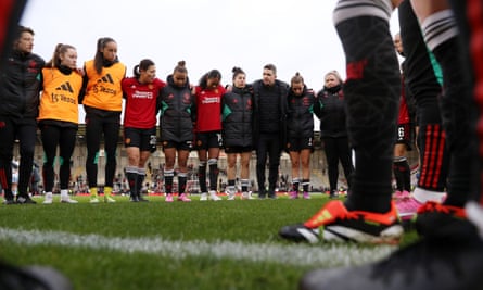 Marc Skinner talks to his players and staff at the end of their match with Aston Villa in January.