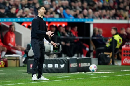 Leverkusen’s head coach Xabi Alonso dishes out instructions during the match