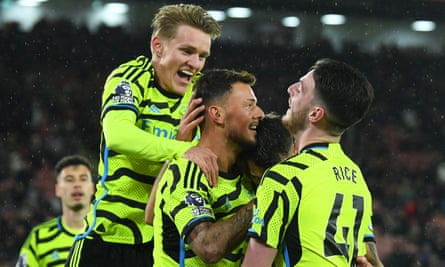 Ben White (centre) is mobbed by his teammates after scoring Arsenal’s sixth