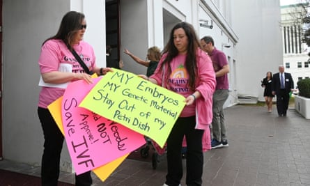 Supporters of legislation safeguarding IVF treatments hold a rally at the Alabama State House. A placard reads: ‘My embryos, my genetic material, stay out of my petri dish’