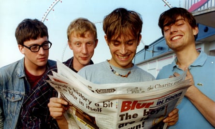 Damon Albarn, Graham Coxon, Dave Rowntree and Alex James in 1995 reading a special Blur edition of the Grimsby Telegraph