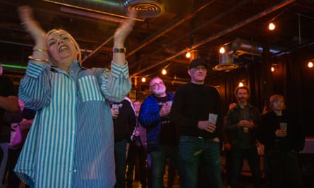 woman cheering at a live music venue