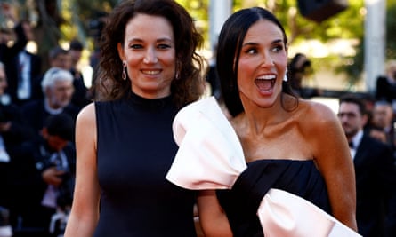 Demi Moore and director Coralie Fargeat on the red carpet for the closing ceremony.