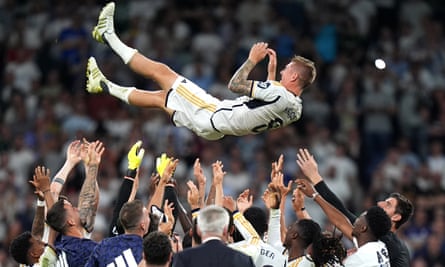 Toni Kroos is thrown into the air by his Real Madrid teammates.