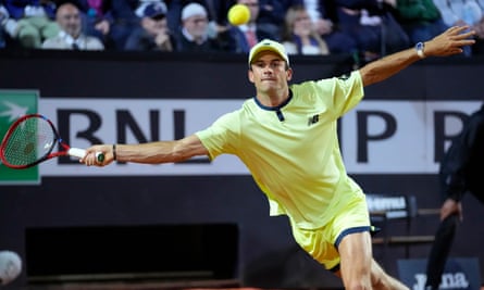 Tommy Paul returns the ball to Nicolas Jarry during their match in Rome
