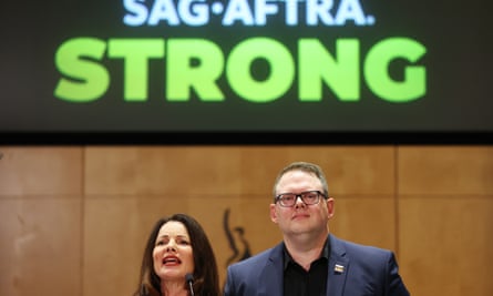 Fran Drescher and Duncan Crabtree-Ireland stand under a ‘Sag-Aftra Strong’ sign