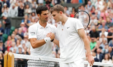 Jack Draper and Novak Djokovic shake hands after a match at Wimbledon.