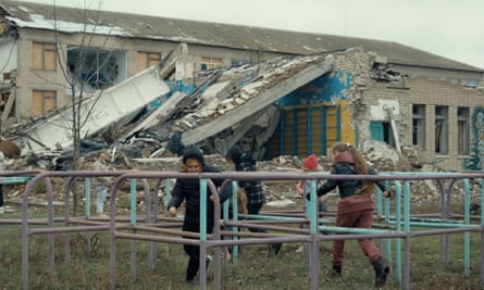 Children play in front of the destroyed Velykokostromska school in Dnipropetrovsk that Alyona Alyona and Jerry Heil are raising funds for.
