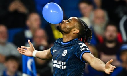 Christopher Nkunku celebrates his goal against Brighton by blowing up a balloon