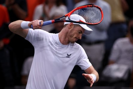 Andy Murray takes his frustrations out on his racket at the Paris Masters in October 2023.