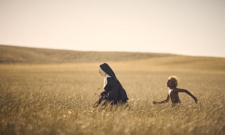 A young Aswan Reid follows Cate Blanchett’s nun through a field in The New Boy.