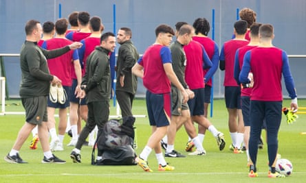 Xavi (centre) leading a Barcelona training session earlier this month.