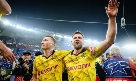 Marco Reus and Niclas Füllkrug celebrate after the semi-final win over PSG.