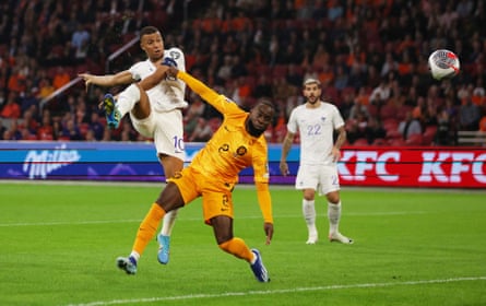 Kylian Mbappé scores against the Netherlands in qualifying.