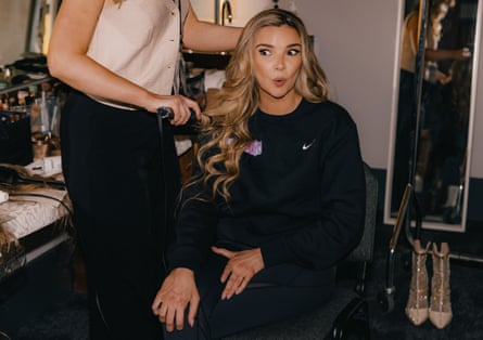 Nadine Coyle in a dressing room having her hair done