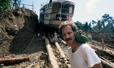 Werner Herzog, with a bird on his shoulder, on the set of Fitzcarraldo in Peru.