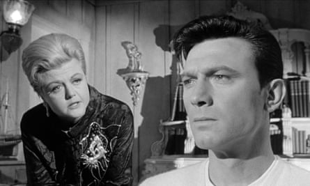 Angela Lansbury and Laurence Harvey in a black and white still from The Manchurian Candidate.