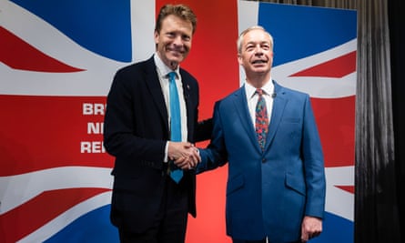 The leader of Reform UK Richard Tice and honorary party president, Nigel Farage shake hands at a press conference in London