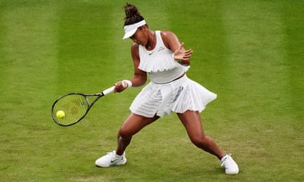 Naomi Osaka swings for the tennis ball at Wimbledon. 