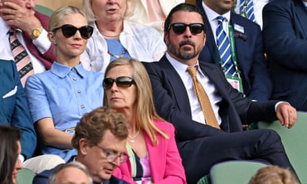 Dave Grohl wears a smart suit to Wimbledon tennis match. 