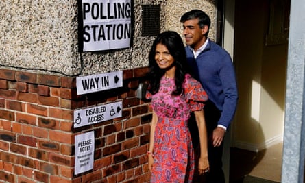 Rishi Sunak and his wife, Akshata Murty, depart after casting their votes at Kirby Sigston village hall