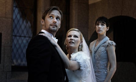 film still of bride and groom looking up at something