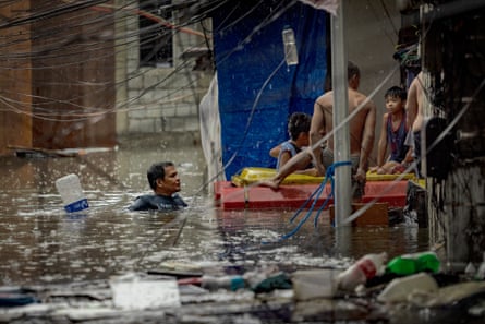 Residents trapped by flooding are rescued in Quezon city, Metro Manila, the Philippines