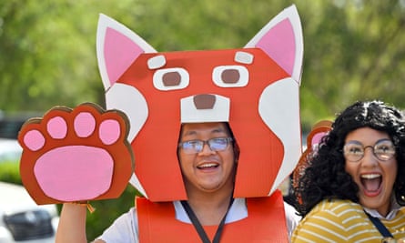 A fan in costume queues up to get into the D23 event.