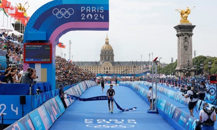 Alex Yee crosses the line for gold in the men’s triathlon