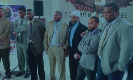 Fathers wearing suits wait for their daughters in a line