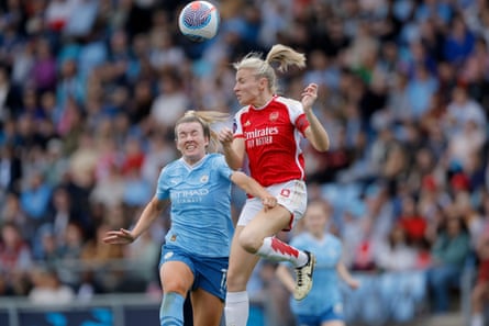 Lauren Hemp of Manchester City and Leah Williamson of Arsenal challenge for the ball