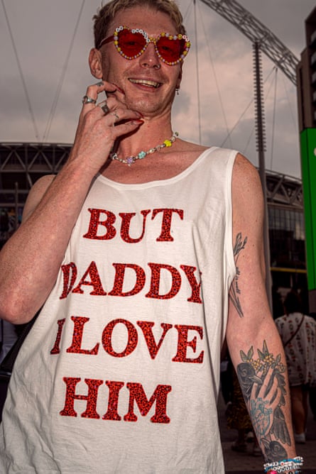 A fan wearing a But Daddy I Love Him t shirt