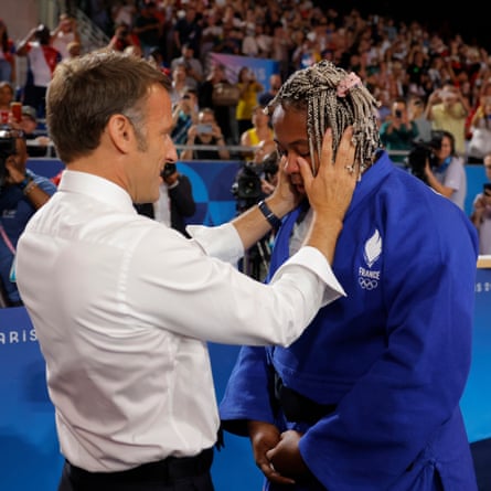 President Macron wipes the tears away from the face of Romane Dicko of France after she won a bronze medal in the women’s 78kg judo competition