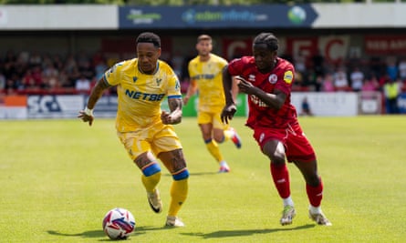 Crystal Palace’s Jordan Ayew (left) and Crawley Town’s Armando Quitirna battle for the ball