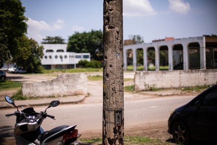 A wooden post with bullet holes.