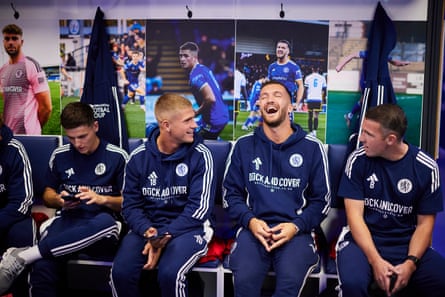 Players joking before kick off.